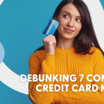 woman with a credit card in her hand, wearing a yellow sweater, on a blue background